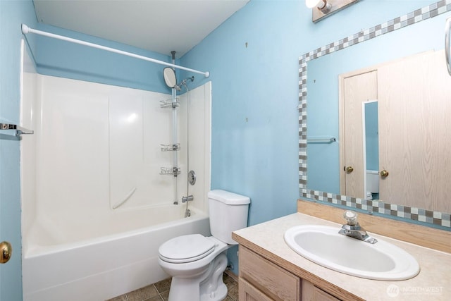 full bathroom featuring tile patterned flooring, toilet, vanity, and  shower combination