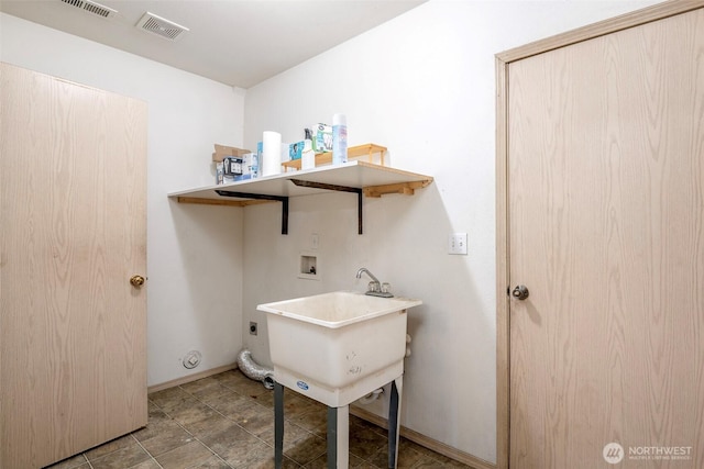 laundry room featuring electric dryer hookup, sink, and hookup for a washing machine