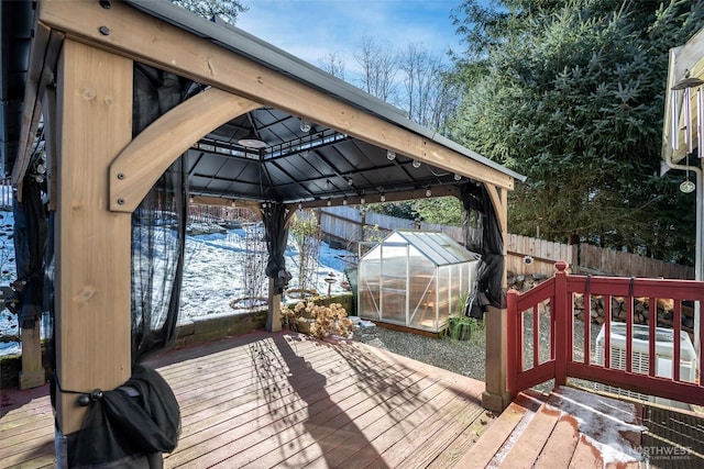 deck with a gazebo and an outbuilding