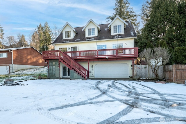 view of front of property with a garage and a deck