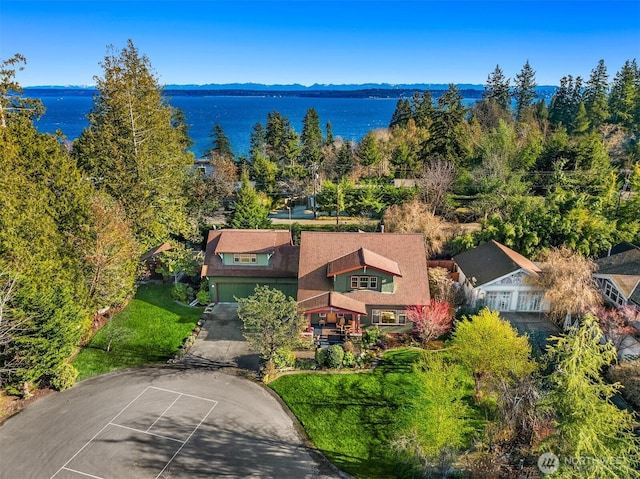 birds eye view of property with a water view