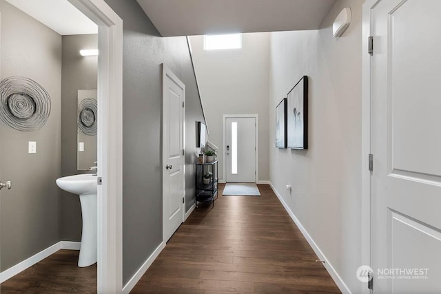 hallway with dark hardwood / wood-style flooring