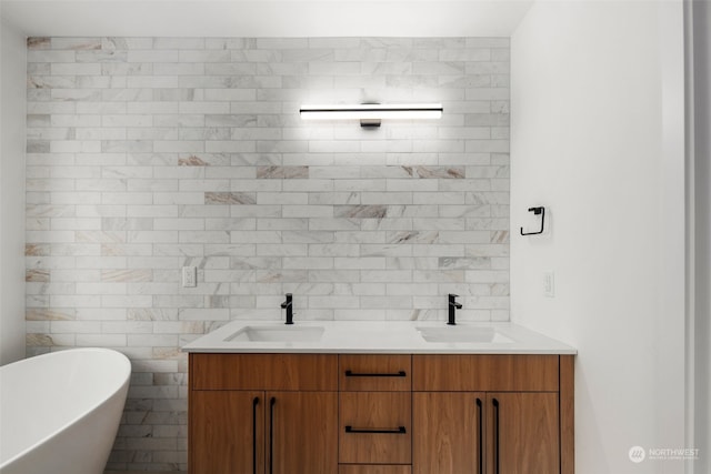 bathroom with a washtub, vanity, and tile walls