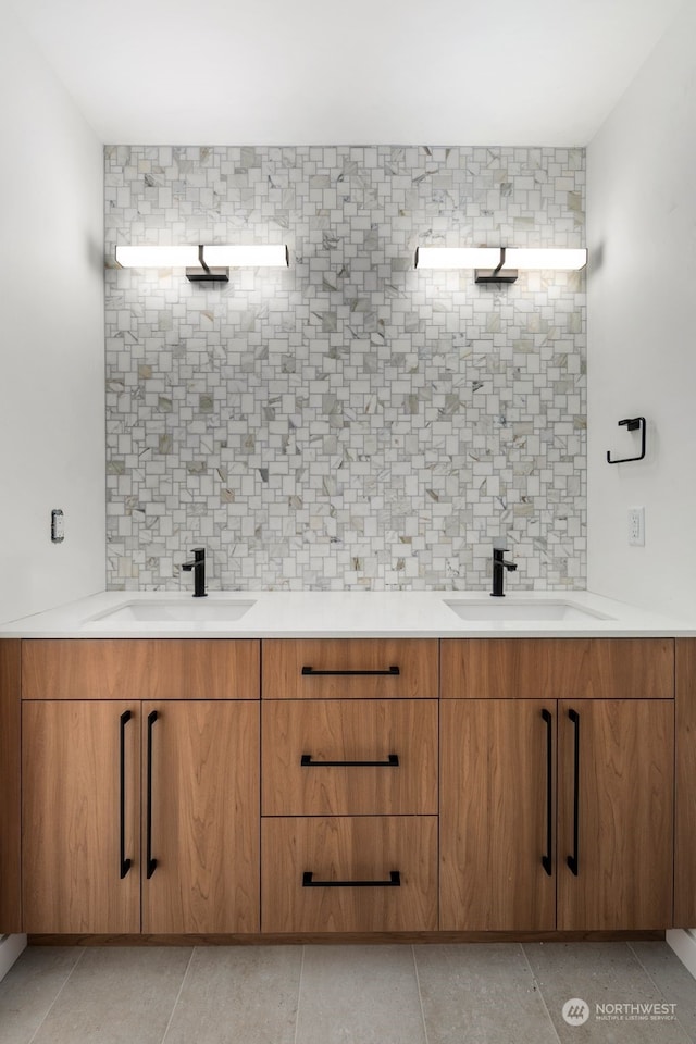 bathroom featuring tasteful backsplash, vanity, and tile patterned flooring