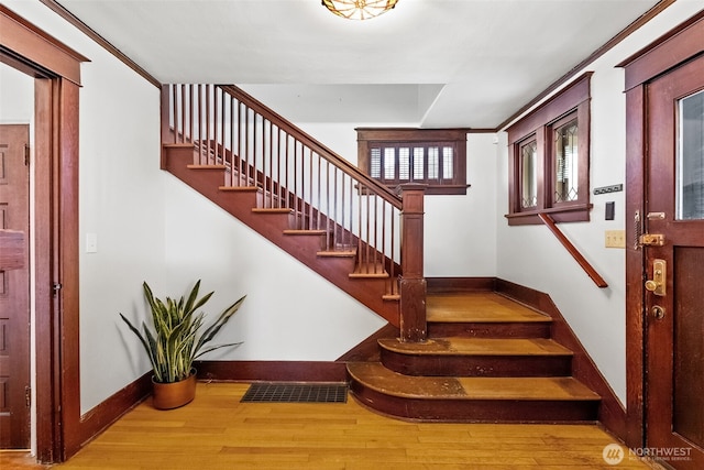 staircase featuring wood-type flooring