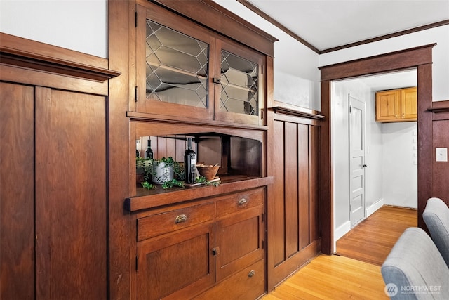 details featuring hardwood / wood-style flooring and crown molding