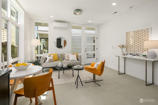 living room featuring a wall unit AC