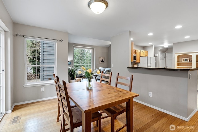 dining room featuring light wood-type flooring