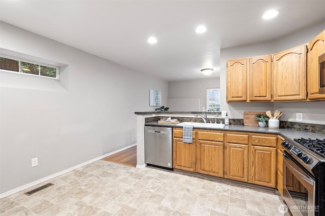 kitchen with sink and appliances with stainless steel finishes