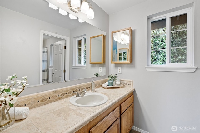 bathroom with vanity and plenty of natural light