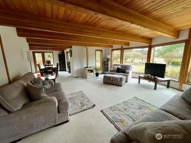 living room featuring wooden ceiling and beam ceiling