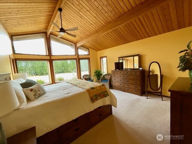 carpeted bedroom with wooden ceiling and lofted ceiling with beams