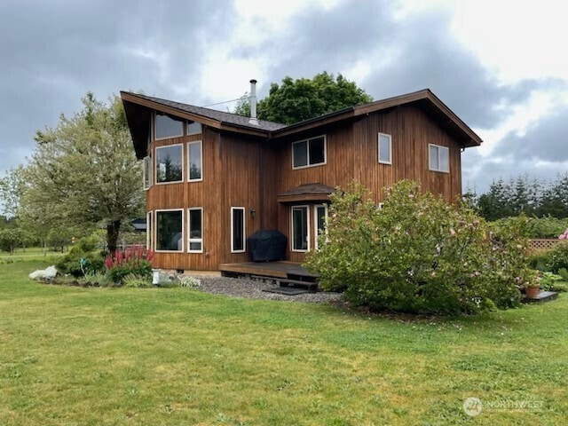 1090 Middle Fork Rd, Onalaska, WA 98570 - back of house featuring a lawn