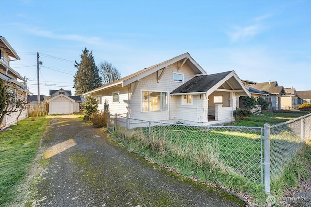 view of front of house with a garage and a front lawn