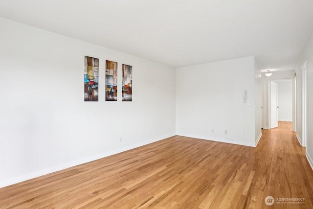 spare room featuring light hardwood / wood-style floors