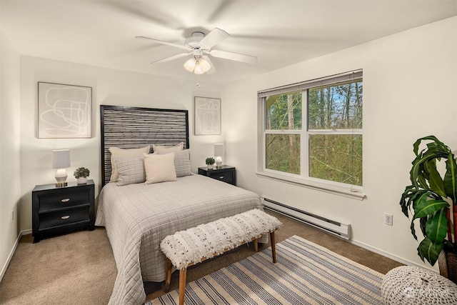 bedroom featuring baseboards, a baseboard heating unit, ceiling fan, and light colored carpet