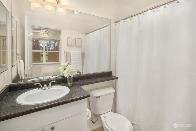 bathroom featuring a ceiling fan, vanity, and toilet