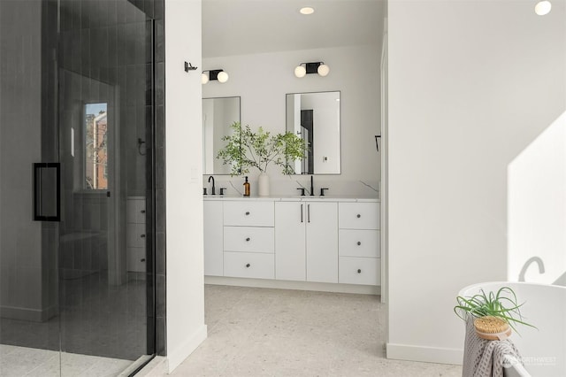 bathroom featuring vanity and an enclosed shower