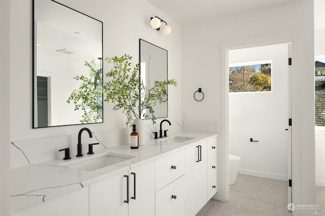 bathroom with vanity and toilet