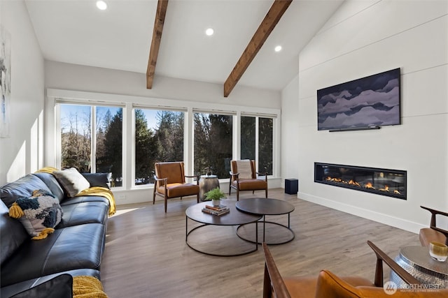 living room with wood-type flooring, high vaulted ceiling, and beam ceiling