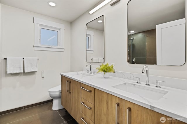 bathroom with vanity, toilet, and tile patterned flooring