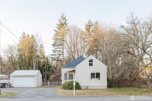 view of front of home with an outbuilding and a garage