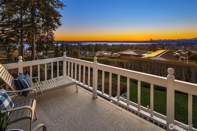 view of balcony at dusk