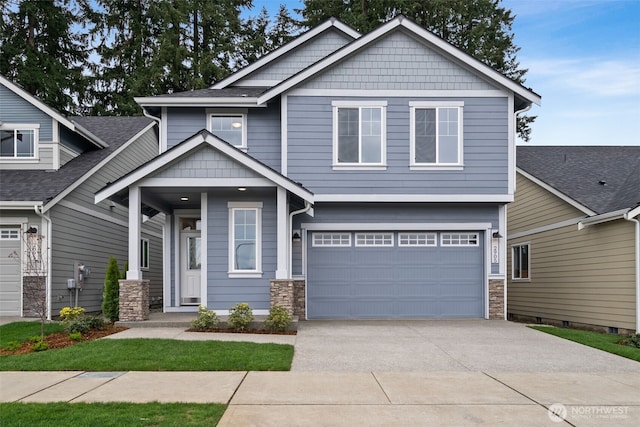 craftsman house with stone siding, driveway, and a garage