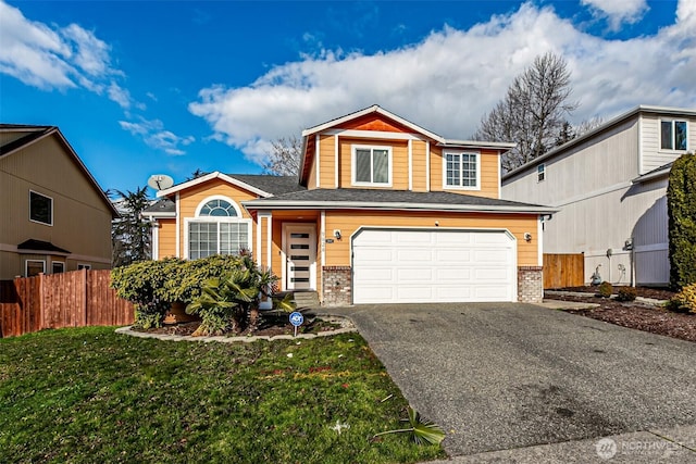 front of property featuring a garage and a front yard