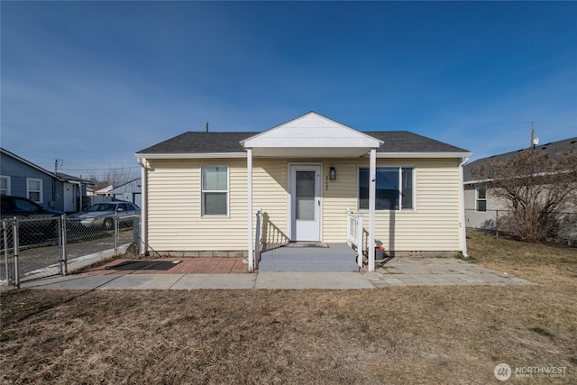 bungalow with a front yard