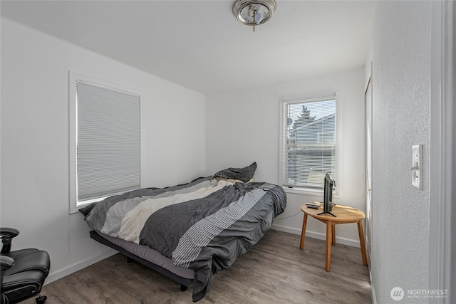 bedroom with light hardwood / wood-style flooring