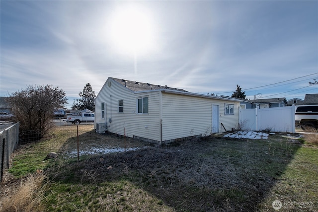 back of house featuring central air condition unit