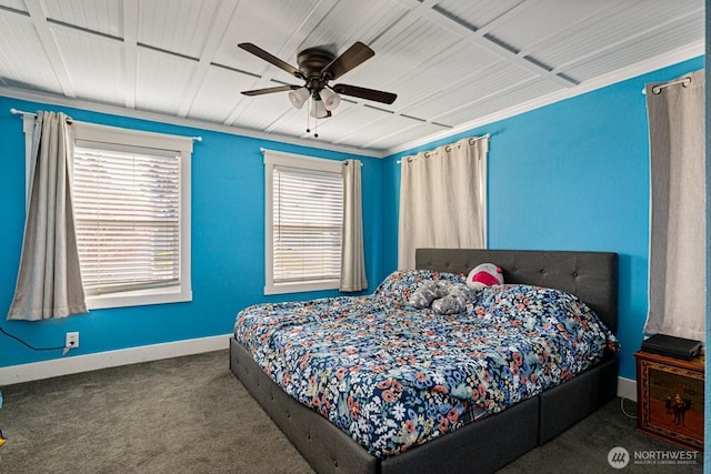 bedroom with ceiling fan and dark carpet