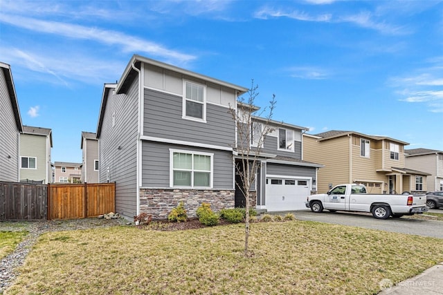 view of front of home with a garage and a front yard