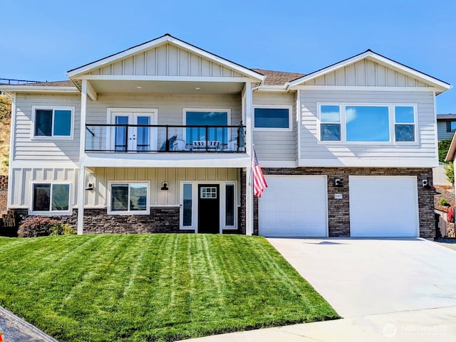2007 Westhaven, Wenatchee, WA 98801 - view of front facade featuring a balcony, a front lawn, board and batten siding, driveway, and stone siding