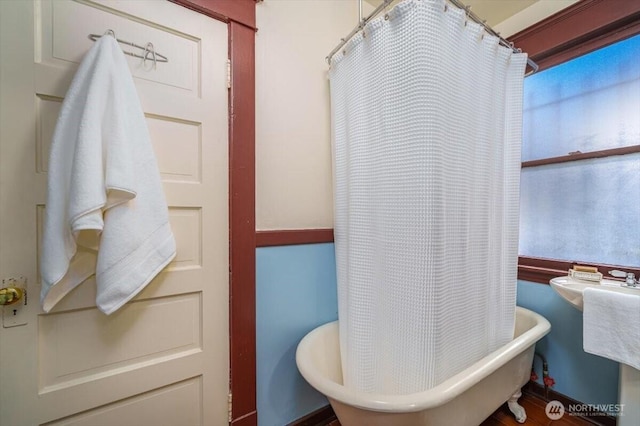 bathroom featuring a tub to relax in