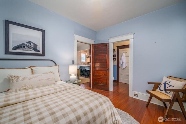 bedroom with hardwood / wood-style floors