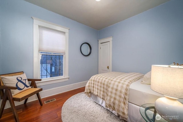 bedroom featuring dark hardwood / wood-style flooring