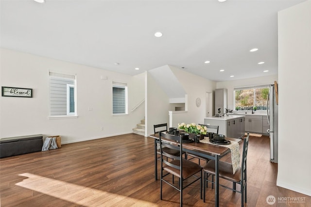 dining space with hardwood / wood-style flooring