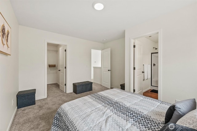 carpeted bedroom featuring ensuite bathroom