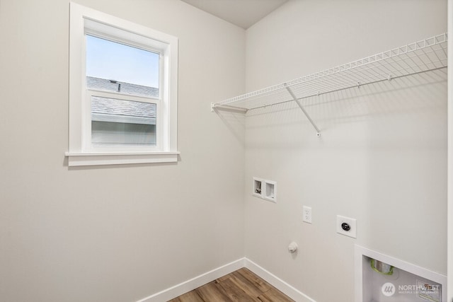 washroom with hookup for a washing machine, gas dryer hookup, hardwood / wood-style floors, and hookup for an electric dryer