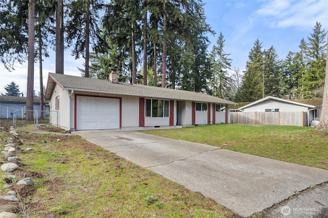 ranch-style house with a garage and a front yard