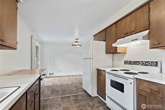 kitchen with sink and white appliances