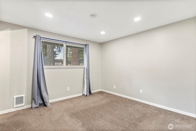 unfurnished room with carpet flooring