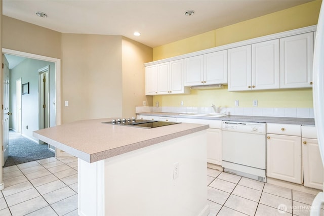 kitchen with white cabinetry, black electric cooktop, white dishwasher, and a center island