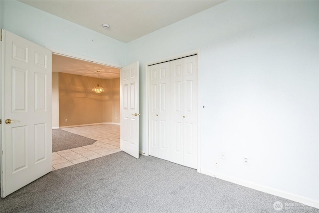 unfurnished bedroom featuring a closet and carpet