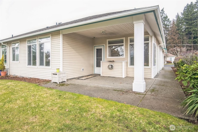 view of front of property with a patio area and a front yard