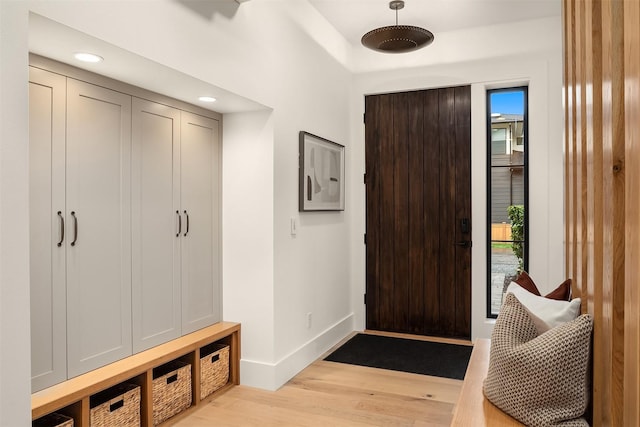 mudroom with light hardwood / wood-style floors