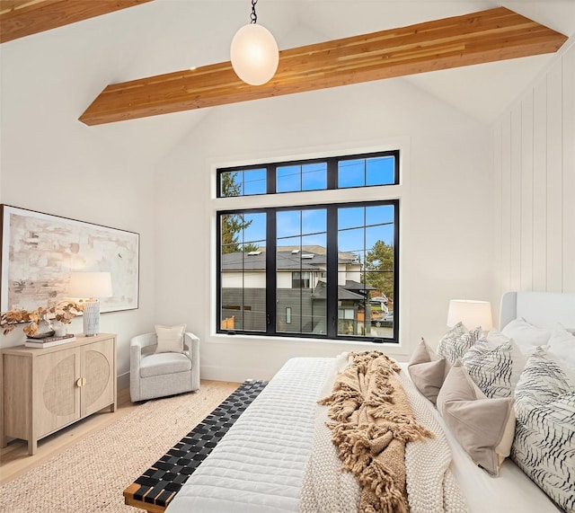 bedroom with high vaulted ceiling