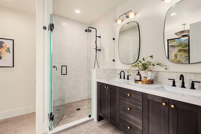 bathroom featuring vanity, an enclosed shower, and backsplash